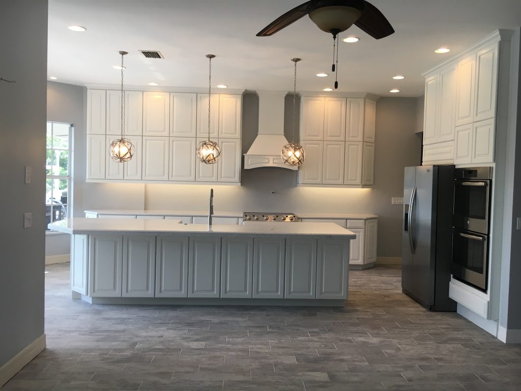 newly renovated kitchen with pendant lighting