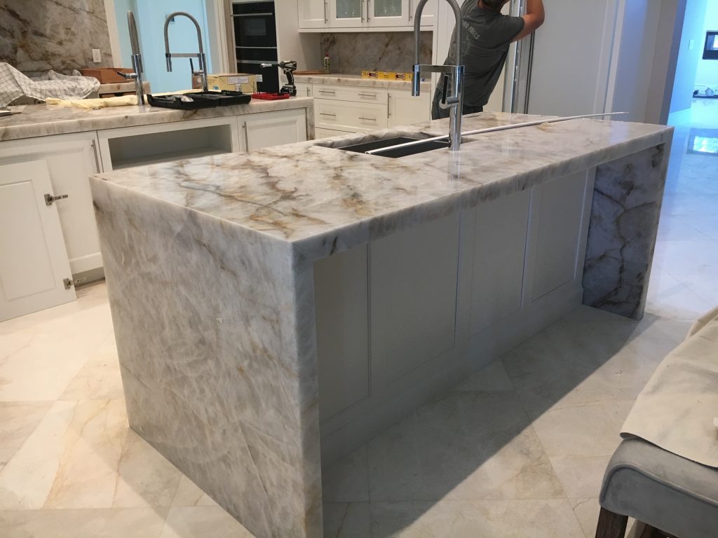gray marble island in kitchen